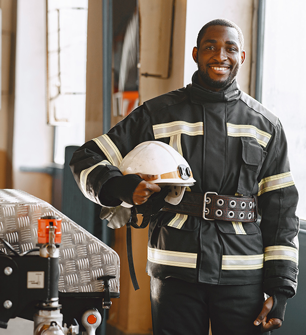 portrait firefighter standing front fire engine
